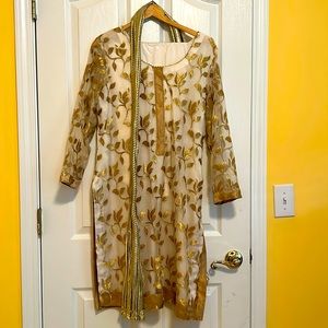Salwar kameez white and gold, worn once, size medium.